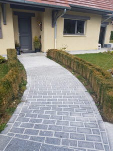 A granite path from the pool to the house